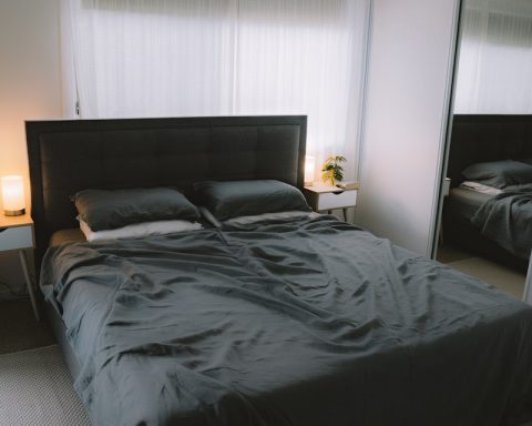 black bed linen on bed