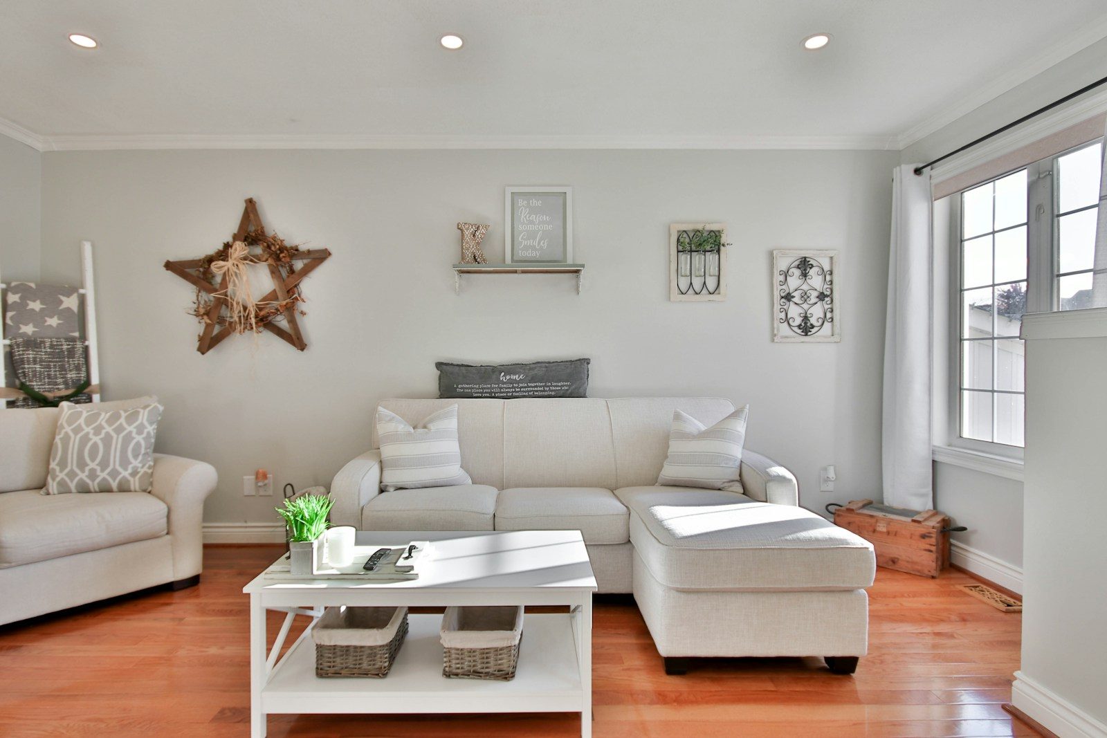 white leather sofa beside brown wooden table